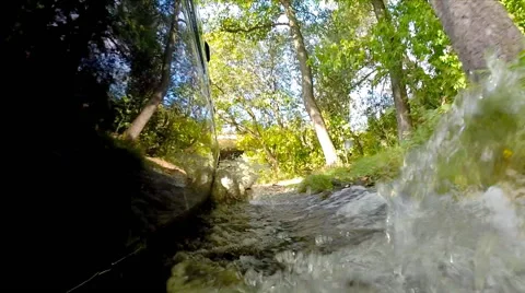 Crossing stream on a car. Stock Footage 42514071