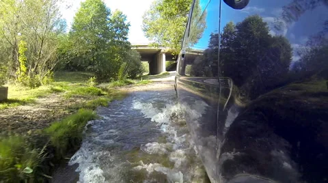 Crossing stream on a car. Stock Footage 42766689