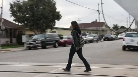 Crossing the street on train tracks Stock Footage 155489771