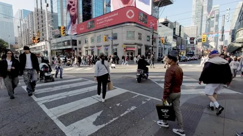 Crossing Yonge and Dundas Intersection during the day Stock Footage 288633465