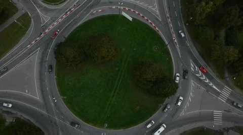 Crossroad roundabout traffic circle counterclockwise car aerial Stock Footage 48473341