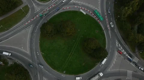 Crossroad roundabout traffic circle counterclockwise car aerial Stock Footage 48473880
