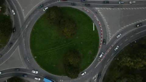 Crossroad roundabout traffic circle counterclockwise aerial Stock Footage 48474557