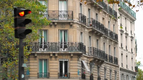 Crossroads, traffic lights and a typical French building in the center of the Stock-Footage 122495690