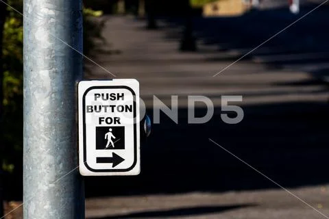 Crosswalk button mechanism on a steel post Stock Photos