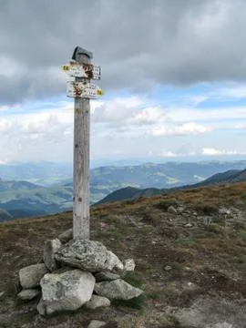 Crosswalk in mountains, old road pointer in rocks 写真素材
