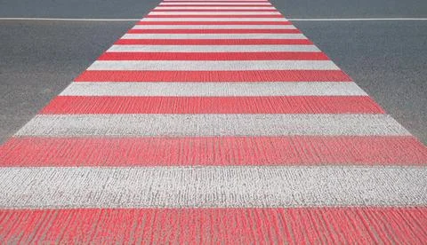 Crosswalk stripes on road Stock Photos