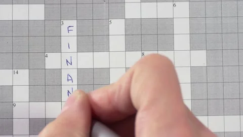 Crossword puzzle with the words finance, money, risk, planning, investing Stock Footage