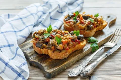 Crostini with roasted vegetables. Stock Photos