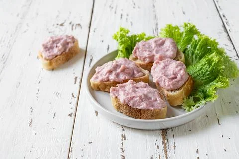 Crostini with tarama on the white table Stock Photos