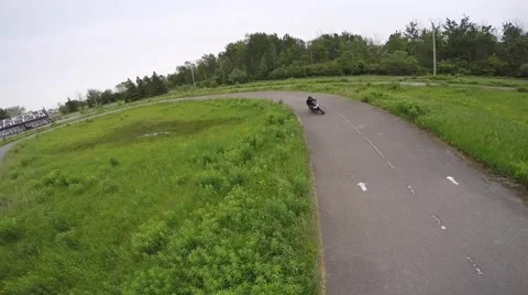 Crotch rocket rides under drone aerial view on track Stock Footage 52140786