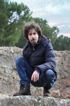 Crouch down man Stock Photos