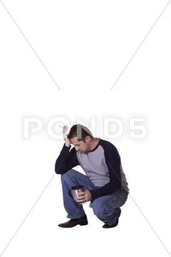 Crouched mediterranean man smoking and drinking coffee Stock Photos