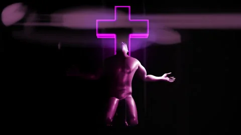Crouching man praying in front of a cross with a flare Stock Footage 242123104