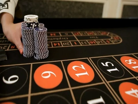 Croupier moves chips on table at casino Stock-Footage 74222715