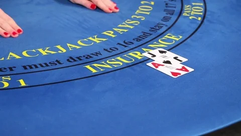 Croupier placing black jack and poker cards on the casino table Stock Footage 71470585