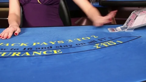 Croupier placing black jack and poker cards on the casino table Video stock 71471093