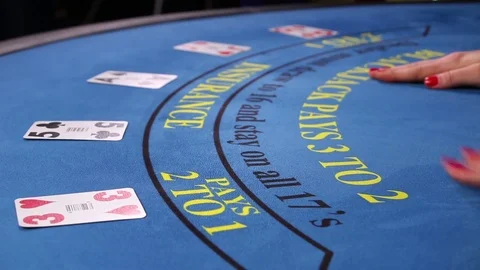 Croupier placing black jack and poker cards on the casino table Stock Footage 71471933