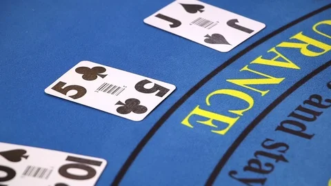 Croupier placing black jack and poker cards on the casino table Stock Footage 71472127