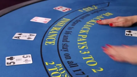 Croupier placing black jack and poker cards on the casino table Stock-Footage 71472649