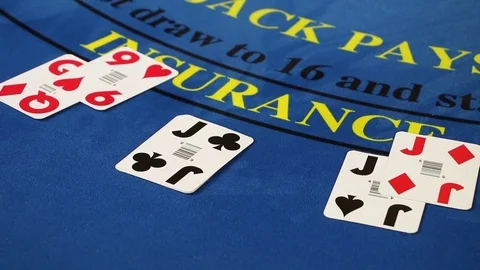 Croupier placing black jack and poker cards on the casino table Stock Footage 71473203