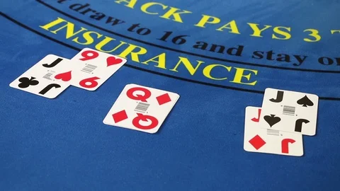 Croupier placing black jack and poker cards on the casino table Stock Footage 71473529