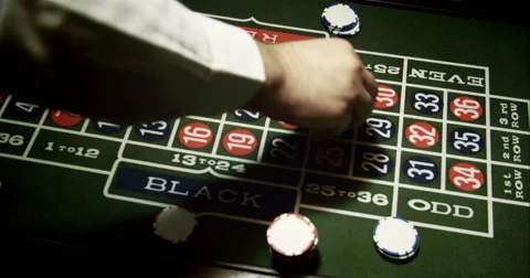Croupier Putting Chips on Roulette Stock Footage 49409476