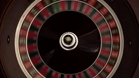 Croupier spins the classic roulette, quickly, white ball Stock Footage 59537692