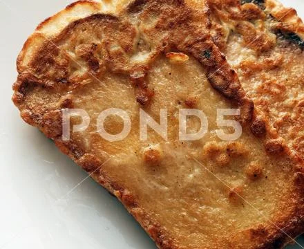 Croutons baked in omelette on a white background Stock Photos