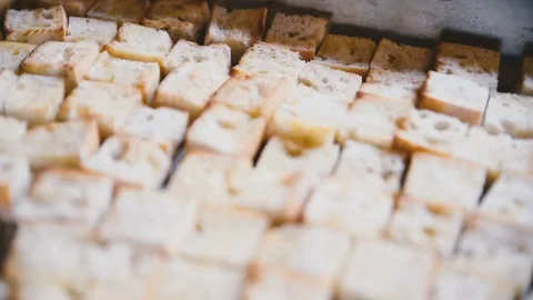Croutons lie on a tray Stock Footage 81544157