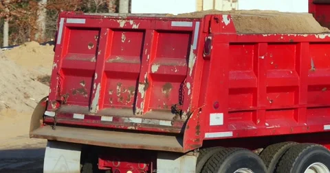 CROW WING CO. - 17 NOV 2025: Red truck with a load of dirt backs up Stock Footage 322720574