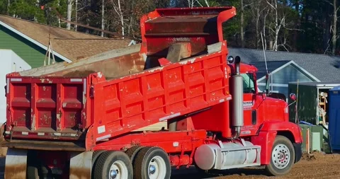 CROW WING CO. - 17 NOV 2025: Red dump truck leaves after dumping load Stock Footage 322720581