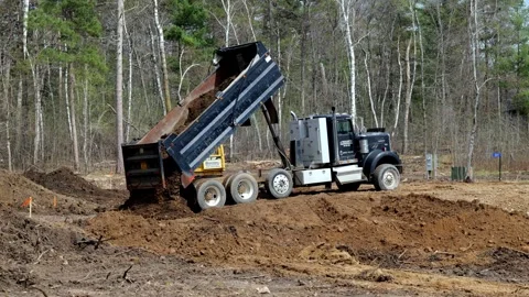 CROW WING CO, MN - 10 MAY 2023: Truck dumps load of dirt. Video stock 250629606