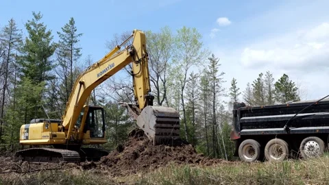 CROW WING CO, MN  12 MAY 2023: Dump truck backs onto work site. Video stock 251059029