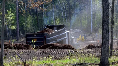 CROW WING CO, MN - 12 MAY 2023: Dump Truck backs up and unloads. Video stock 251088686