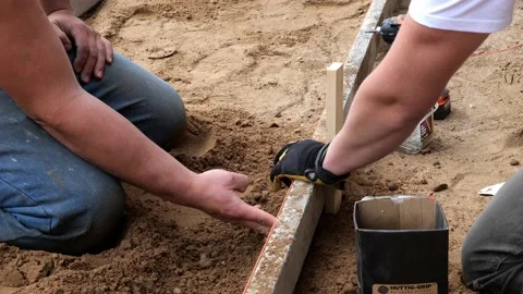 CROW WING CO, MN - 3 MAY 2021: Construction worker hammers wood stake. Stock Footage 154869544