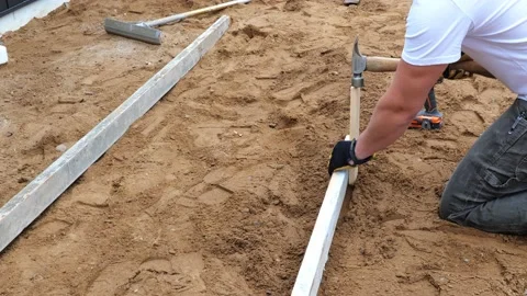 CROW WING CO, MN - 3 MAY 2021: Working man and hammer and wood stake. Stock Footage 155134531