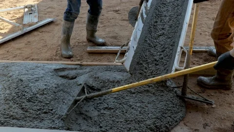 CROW WING CO, MN - 3 MAY 2021: Wet cement concrete pours out of chute. Stock Footage 155134883