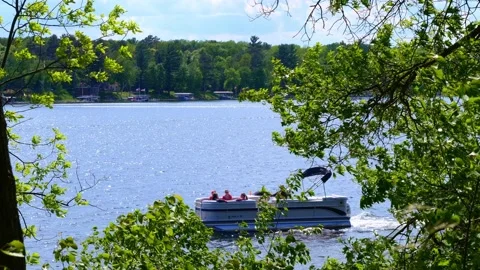 CROW WING CO, MN - 30 MAY 2021: Family in pontoon on a Minnesota lake. Stock Footage 155448669