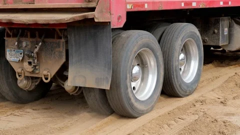 CROW WING CO, MN - 5 MAY 2010: Dump truck leaves home construction site. Stock Footage 155869749