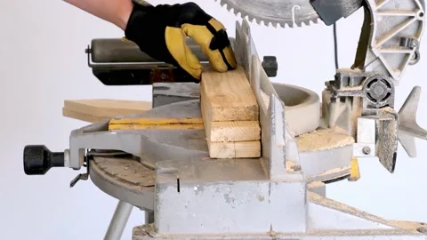 CROW WING, CO, MN - 5 MAY 2021: DeWalt miter saw custs wood boards. Stock Footage 156633679