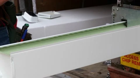 CROW WING, CO, MN - 5 MAY 2021: Gutter outlet is cut and added to aluminum. Stock Footage 156760586