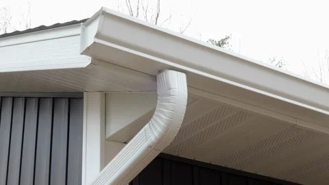 CROW WING CO, MN - 5 MAY 2021: Downspout attached to rain gutter. Stock Footage 156813748