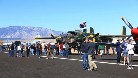 Crowd at Airshow looking at Static Displays of Aircraft on Tarmac Stock Footage 96411707
