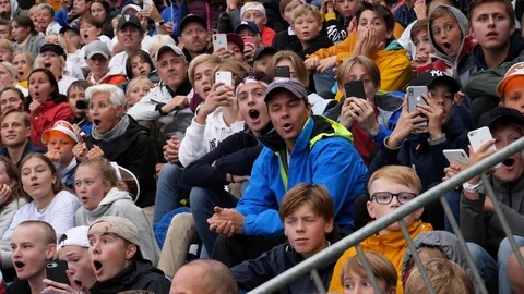 Crowd is amazed as they watch a sporting event and react Stock Footage 119547607