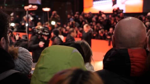 Crowd and fans taking photos at a red carpet film festival event Stock Footage