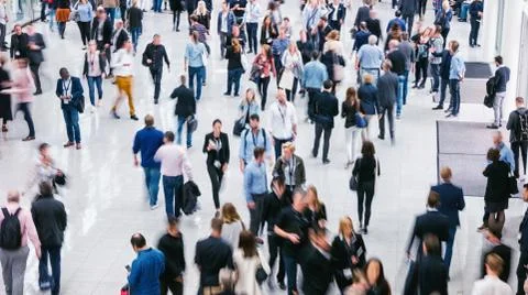 Crowd of anonymous people walking Stock Photos