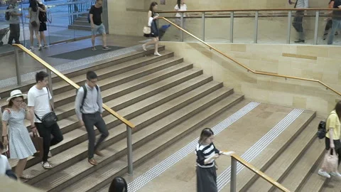 Crowd of anonymous people walking underground crossing subway in rush hour Video stock 95629143