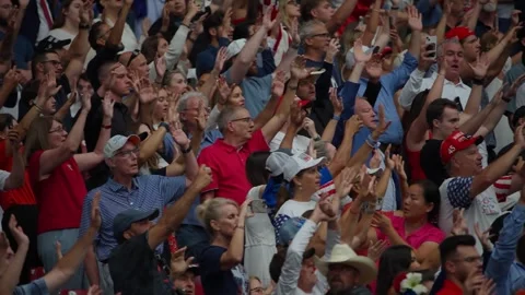The crowd applauds during the Charlie Kirk memorial service Stock Footage 345298048