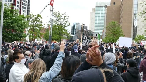 Crowd applauds during demonstration Stock Footage 132379026